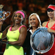 Serena Williams, holding the Daphne Akhurst Memorial Cup, with Martina Navratilova and Maria Sharapova, who holds the runner-up plate, after their women’s finals match at the Australian Open at Melbourne Park on Jan. 31, 2015. (Cameron Spencer/Getty Images)